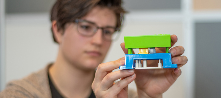 engineer student reviewing protolabs injection moulding demo mould