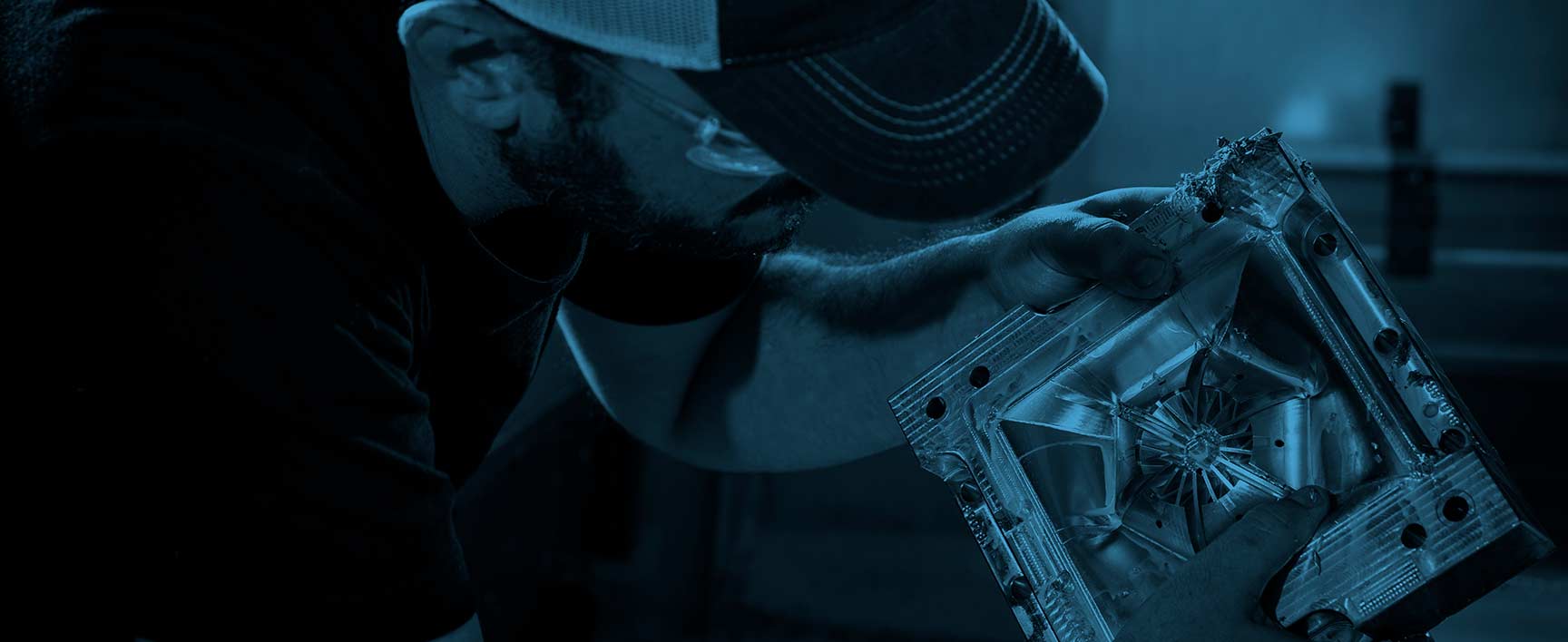 examining a CNC milled aluminium mould