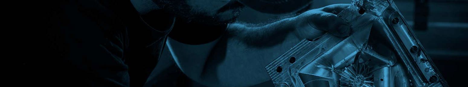 examining a CNC milled aluminium mould