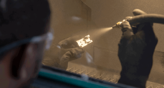 Bead blasting a metal machined part