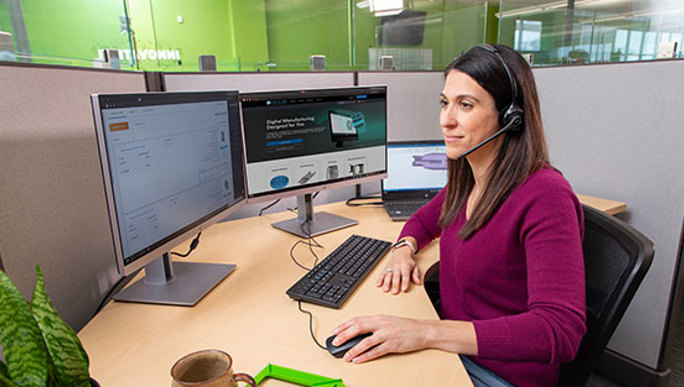 Woman sitting at computer desk