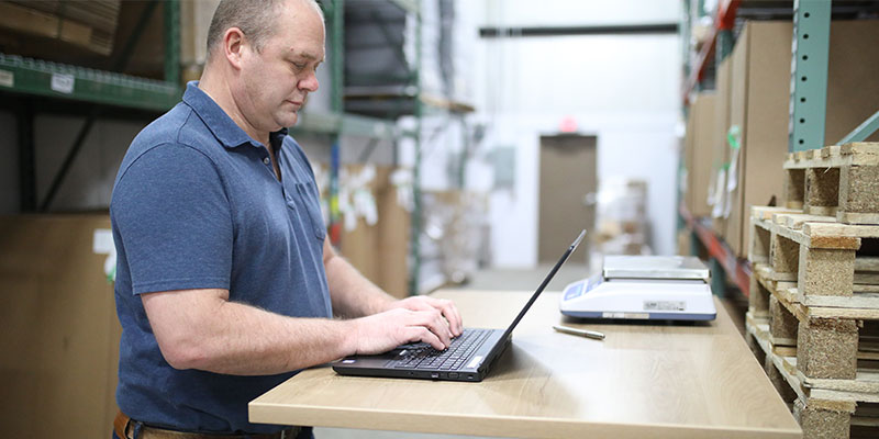 Man typing on laptop computer